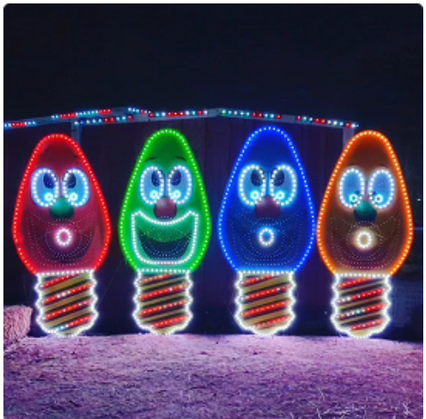 Four giant lit Christmas bulb characters